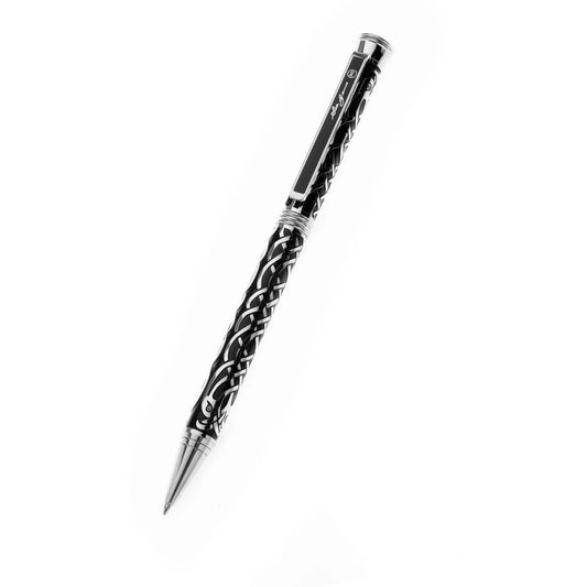 A black and silver ballpoint pen with Celtic birds design