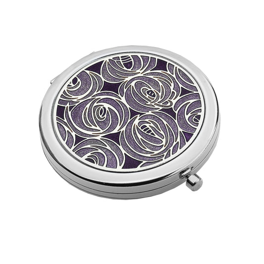 A compact mirror featuring an enamel top with Mackintosh roses in a lilac colour