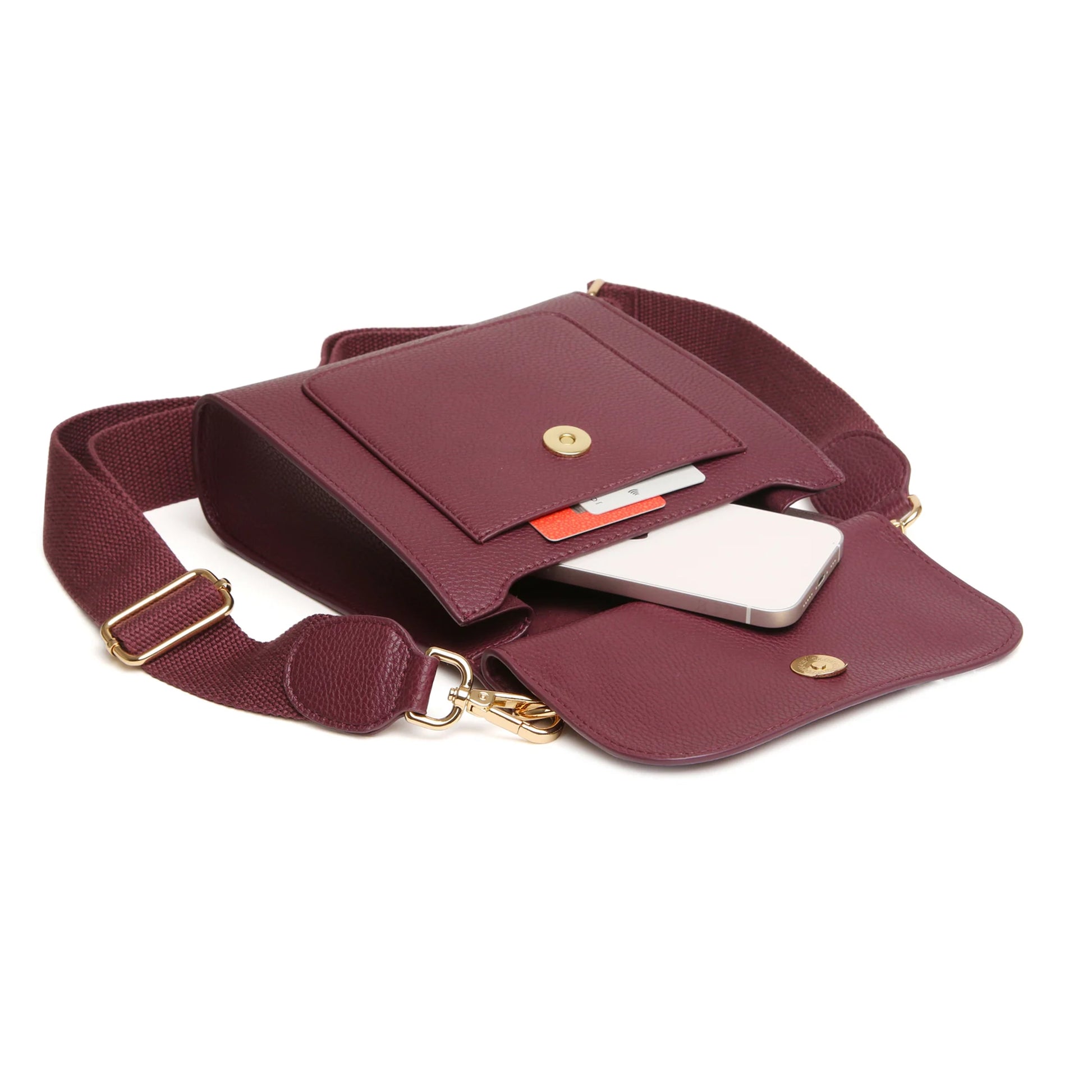 Open berry red faux leather crossbody bag with magnetic flap over and slip pocket