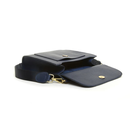 Navy blue faux leather crossbody bag open with magnetic closure and front pocket