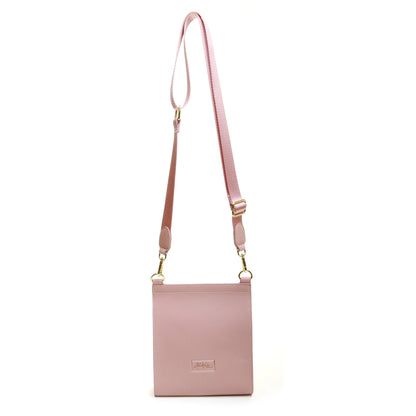 back of pink faux leather crossbody bag with bee emblem magnetic flap over and adjustable strap
