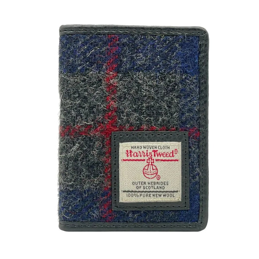A fold over card holder featuring a blue check coloured Harris tweed front