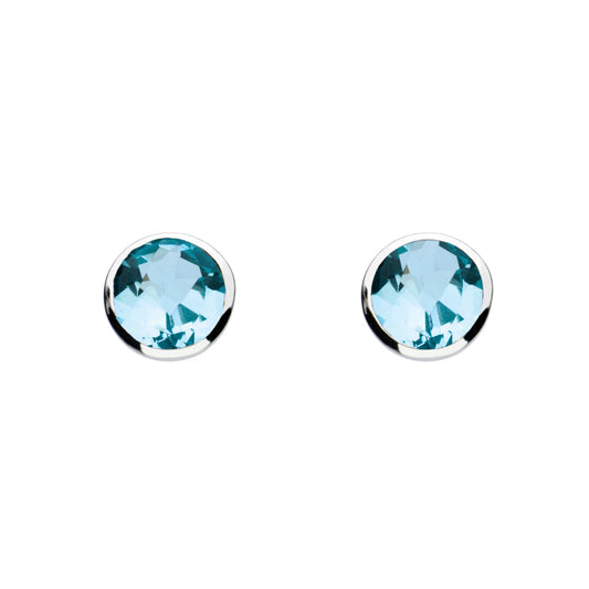 A pair of silver round stud earrings with faceted blue topaz stones