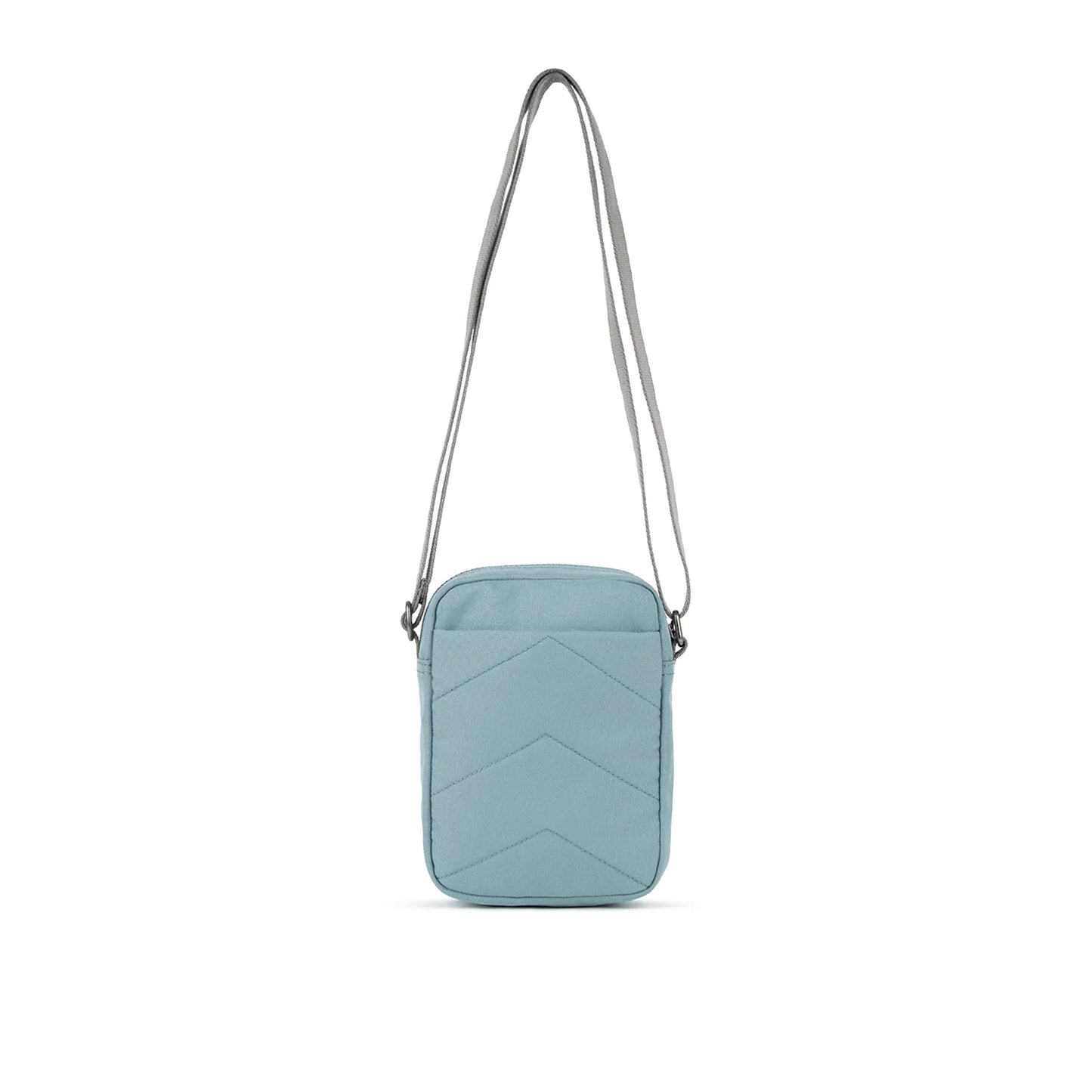 A small crossbody bag in canvas material and a light blue colour back