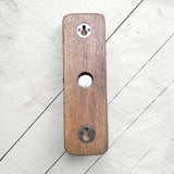 Back of a whisky barrel bottle opener with keyhole wall mount fittings