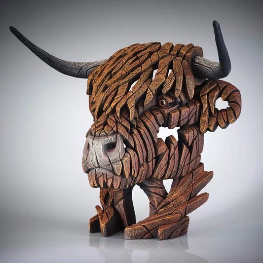 A textured and painted brown Highland cow head bust sculpture side view