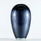 A rounded vase in ombre black enamel