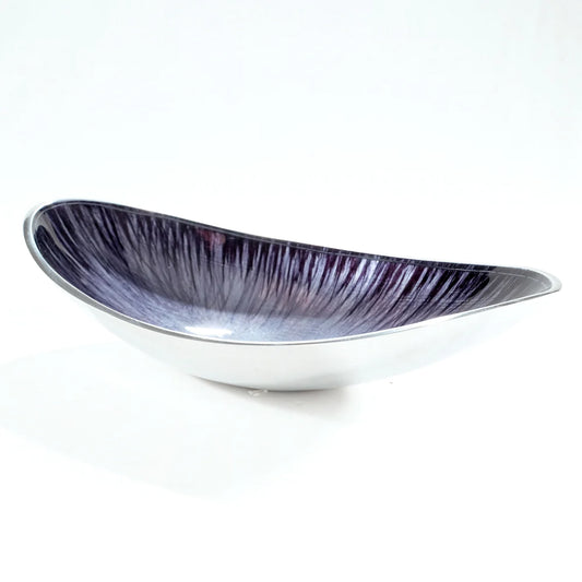 A long boat shaped bowl in silver aluminium with black enamelled centre