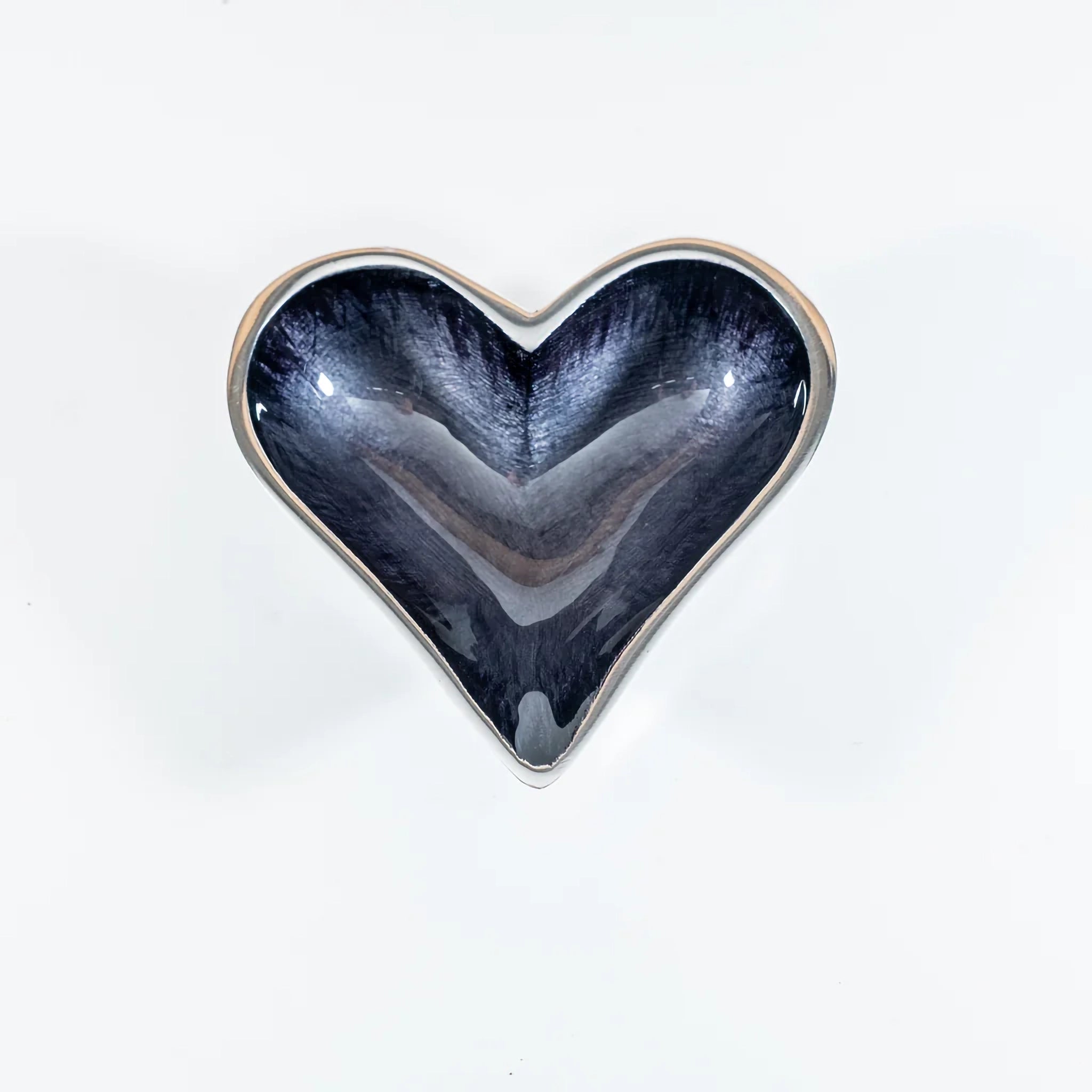 A silver aluminium heart shaped dish with black ombre enamel inside  top view