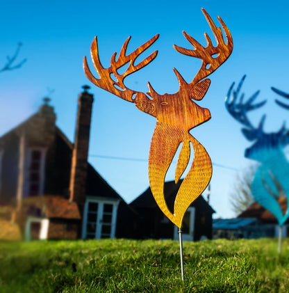 Brown wood look cut out stag wall on lawn