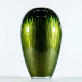 A rounded vase in ombre green enamel