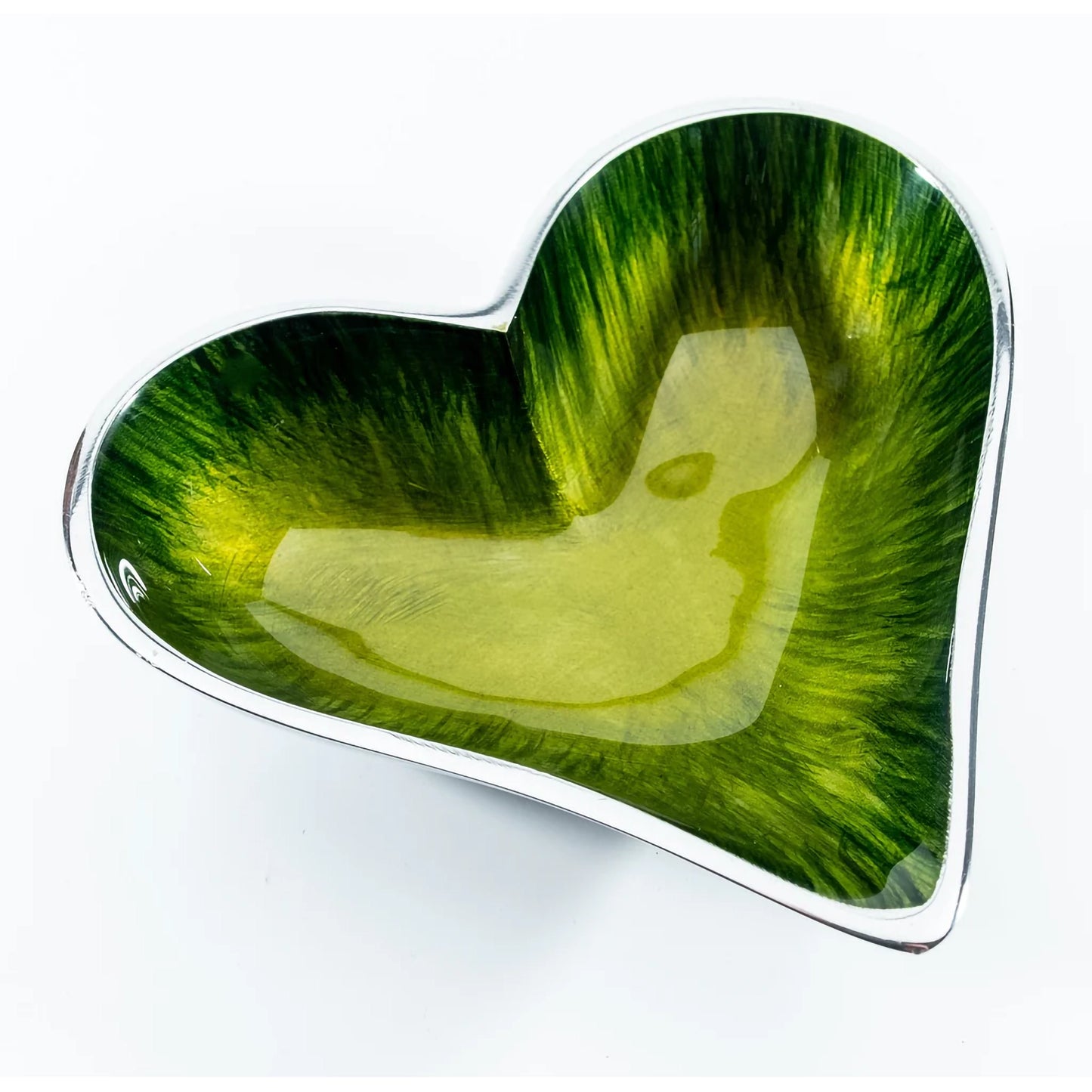 A silver aluminium heart shaped dish with green ombre enamel inside