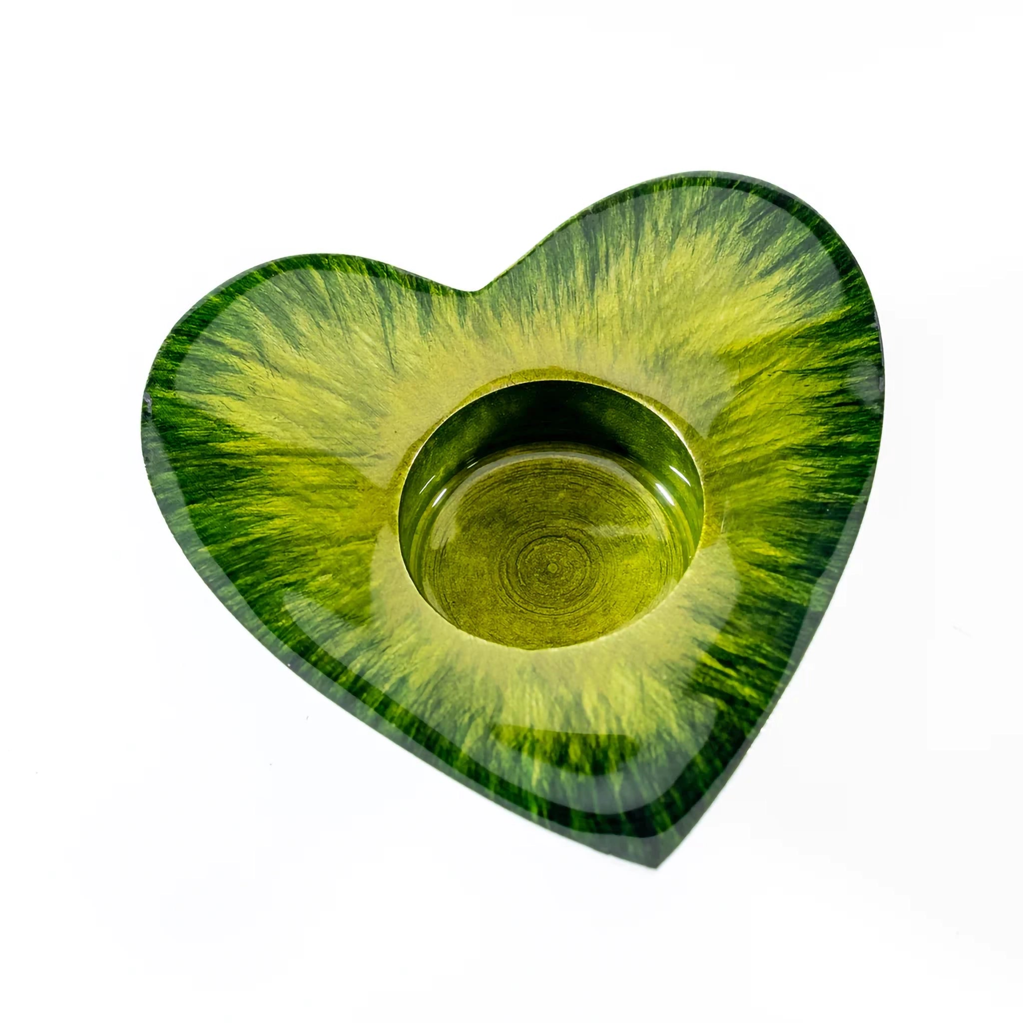 A green enamel decorated heart shaped t-light holder