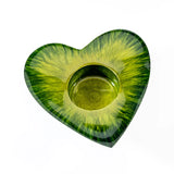 A green enamel decorated heart shaped t-light holder