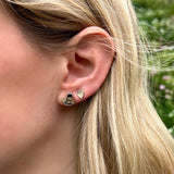 Polished silver bee stud earrings with black & yellow enamel on model