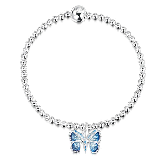 A silver beaded bracelet with a blue enamel butterfly pendant