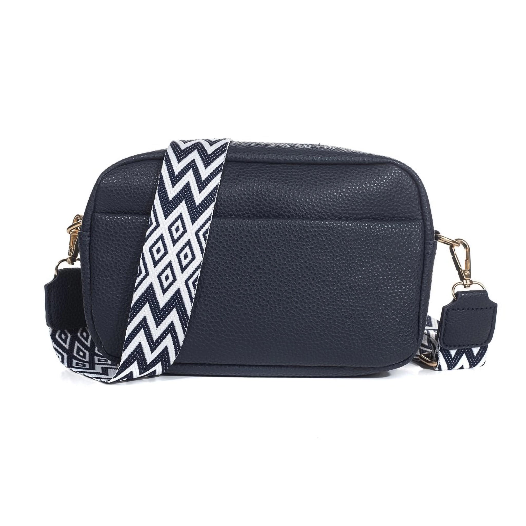 A navy leather look camera bag with a western look black and white strap