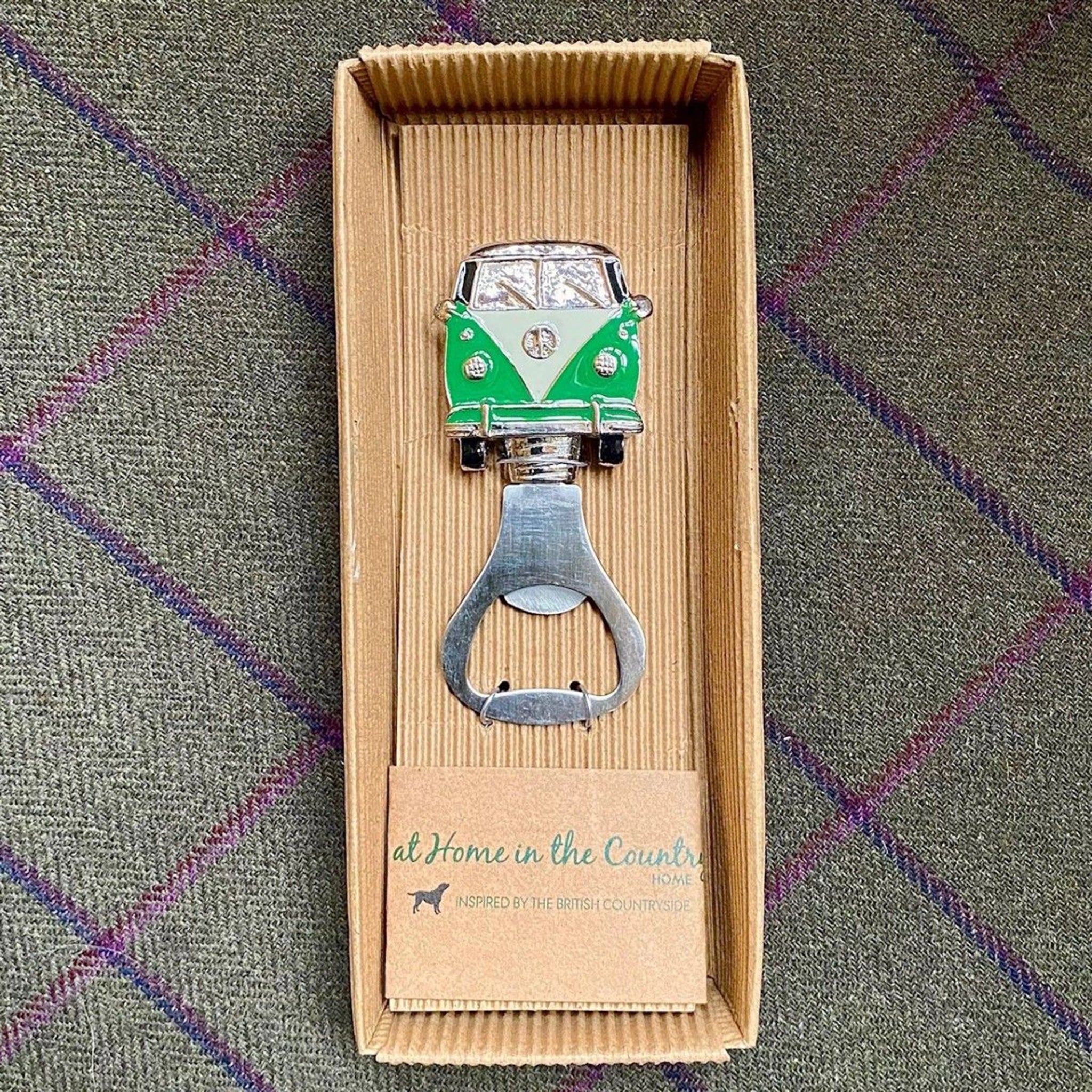 An enamelled campervan bottle opener in green and white in box