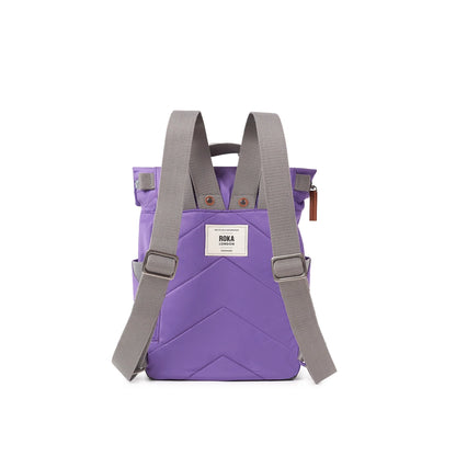 Purple rolltop backpack with grey shoulder straps