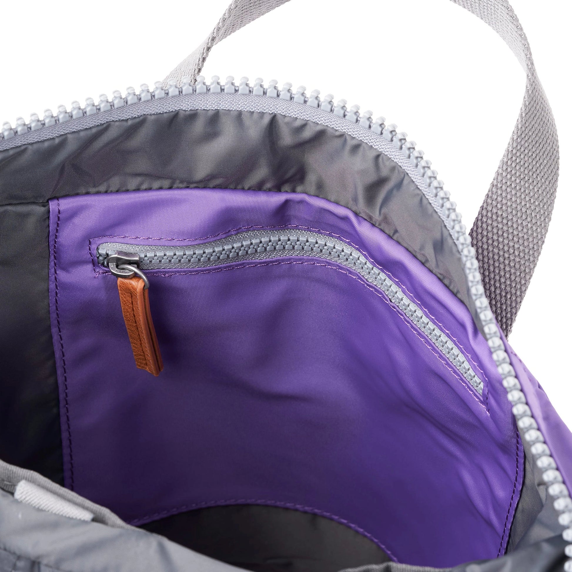Purple rolltop backpack with internal zip pocket