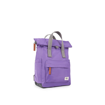 Purple rolltop backpack with grey grab handles side view