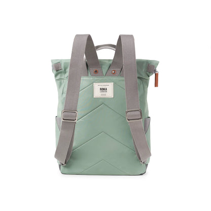 Mint green rolltop backpack with grey adjustable shoulder straps