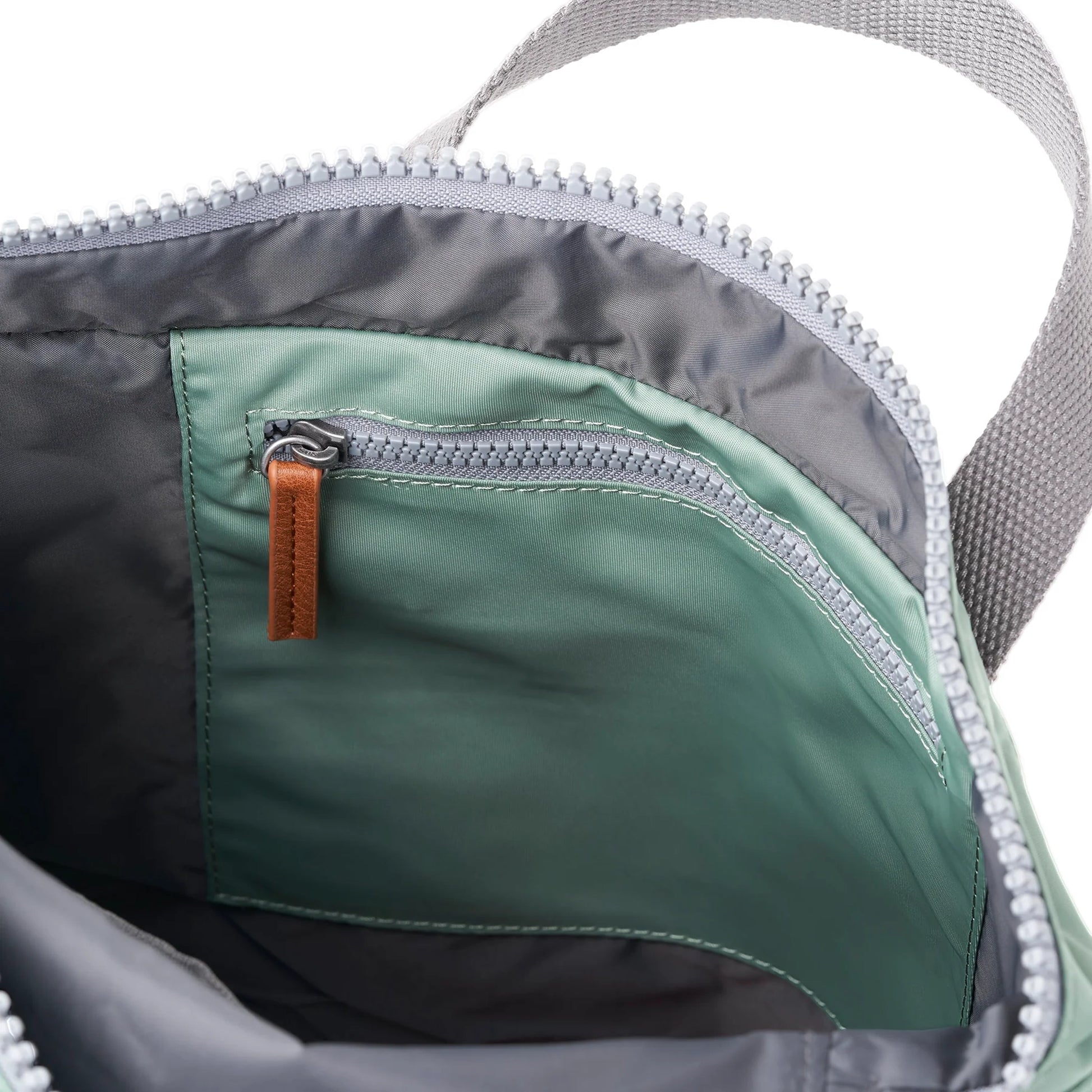 Mint green rolltop backpack with internal zip pocket
