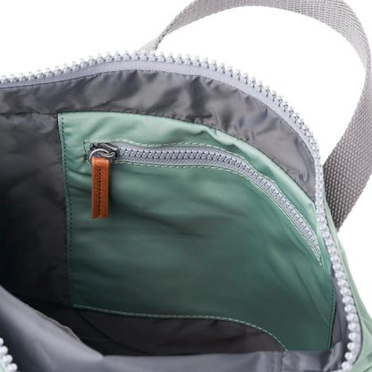 Mint green rolltop backpack with internal zip pocket