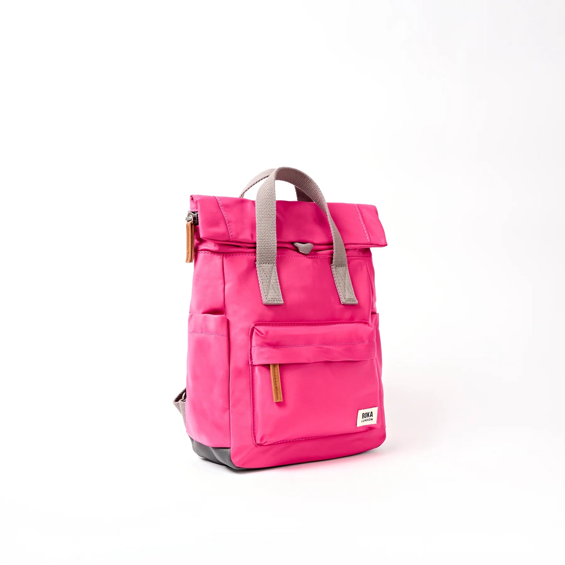 Bright pink hiking roll top backpack with grey handle side