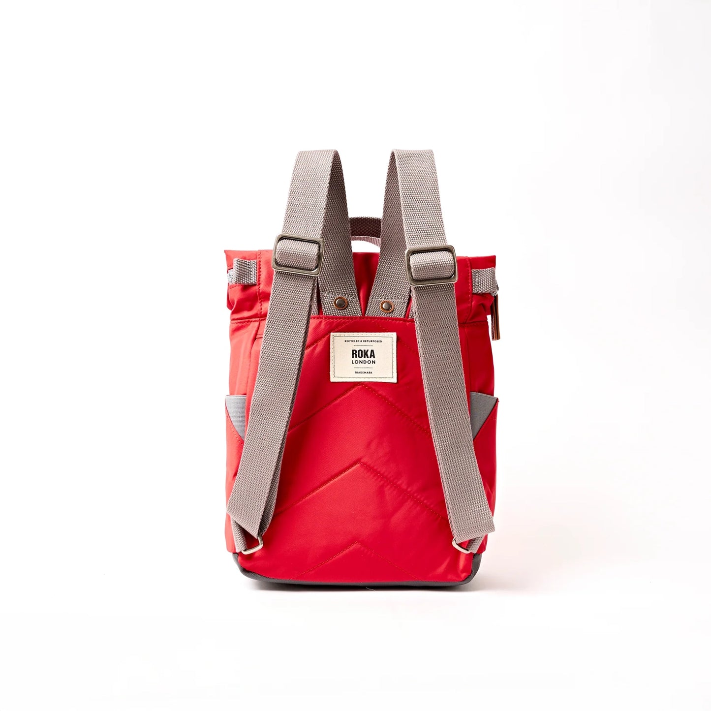 Bright red hiking roll top backpack with grey shoulder straps
