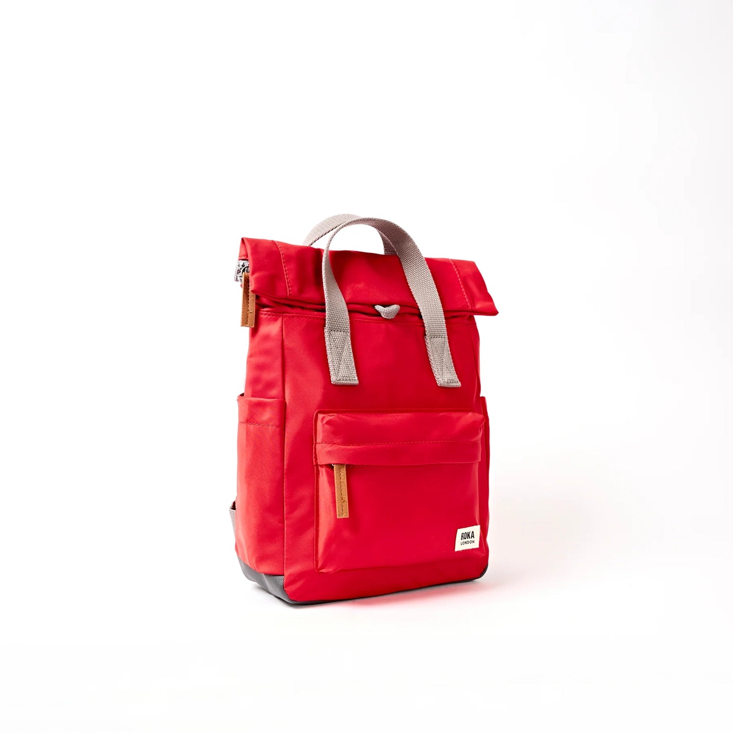 Bright red hiking roll top backpack with grey handle side