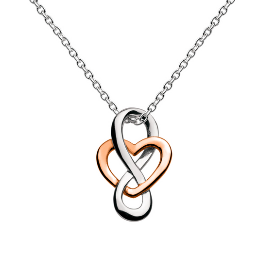 A silver pendant with a rose gold heart shape