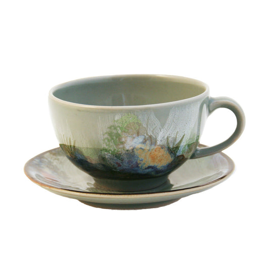 Wide brim glazed cappuccino cup and saucer set, featuring hand painted design of a rock pool bottom