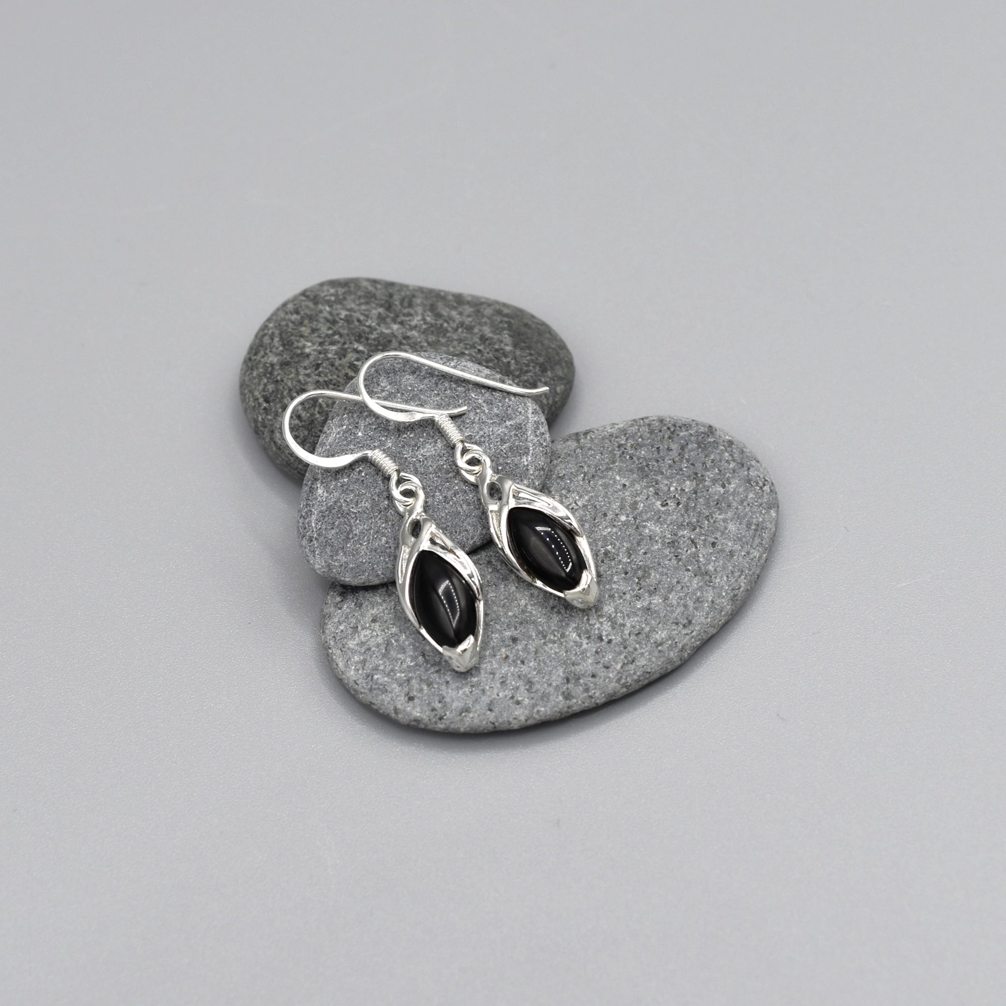 A pair of Celtic drop earrings with black onyx stones