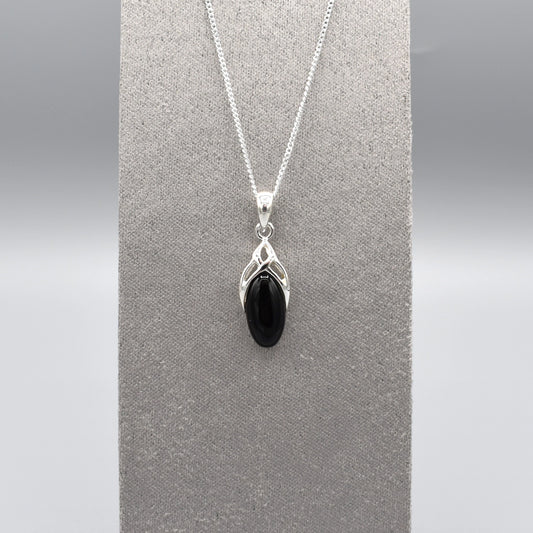 A simple silver Celtic pendant with oval black onyx stone