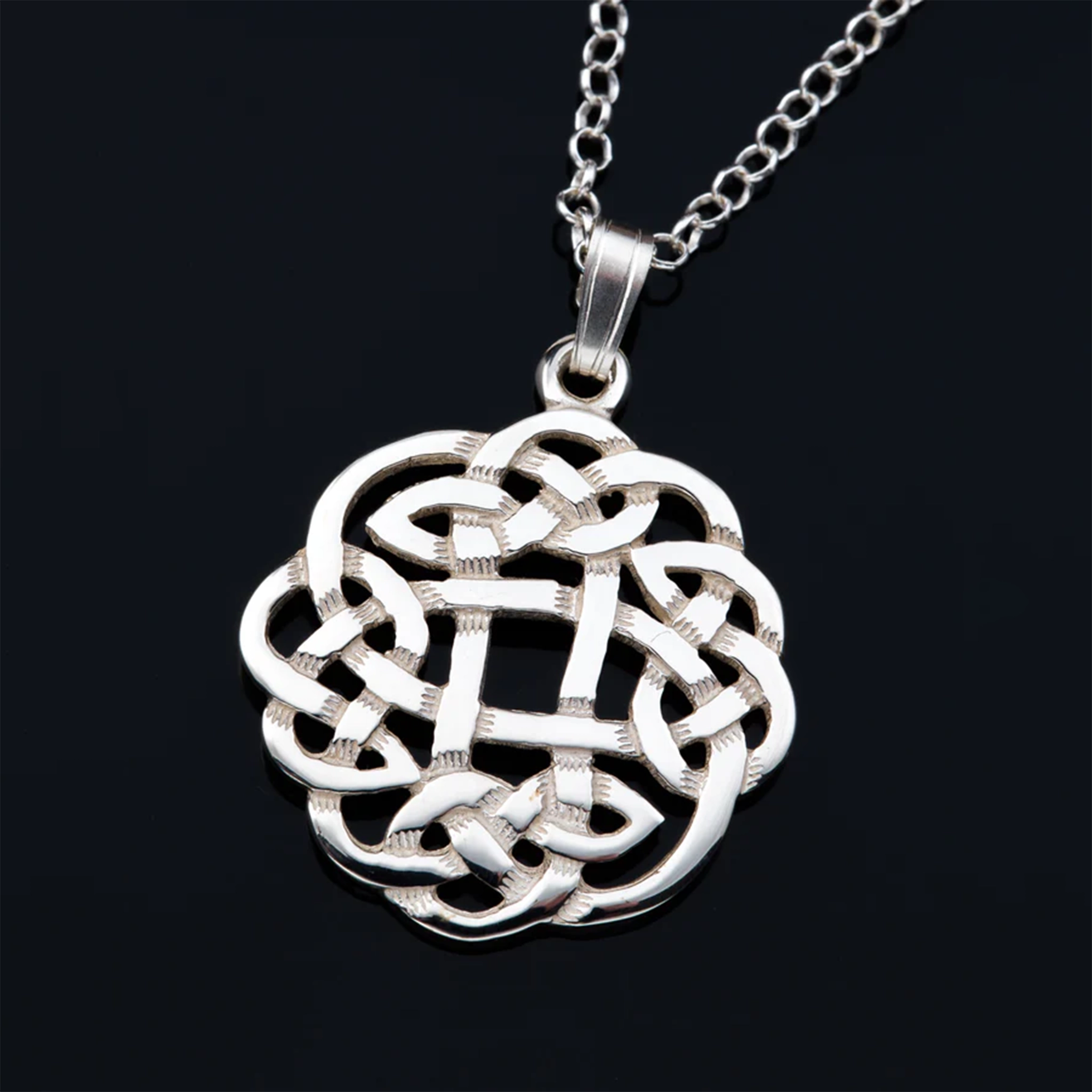 A round Celtic weave knot silver pendant on a silver mini bell chain