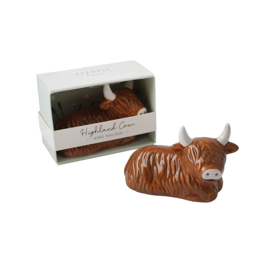 A ceramic Highland Cow shaped ring holder 