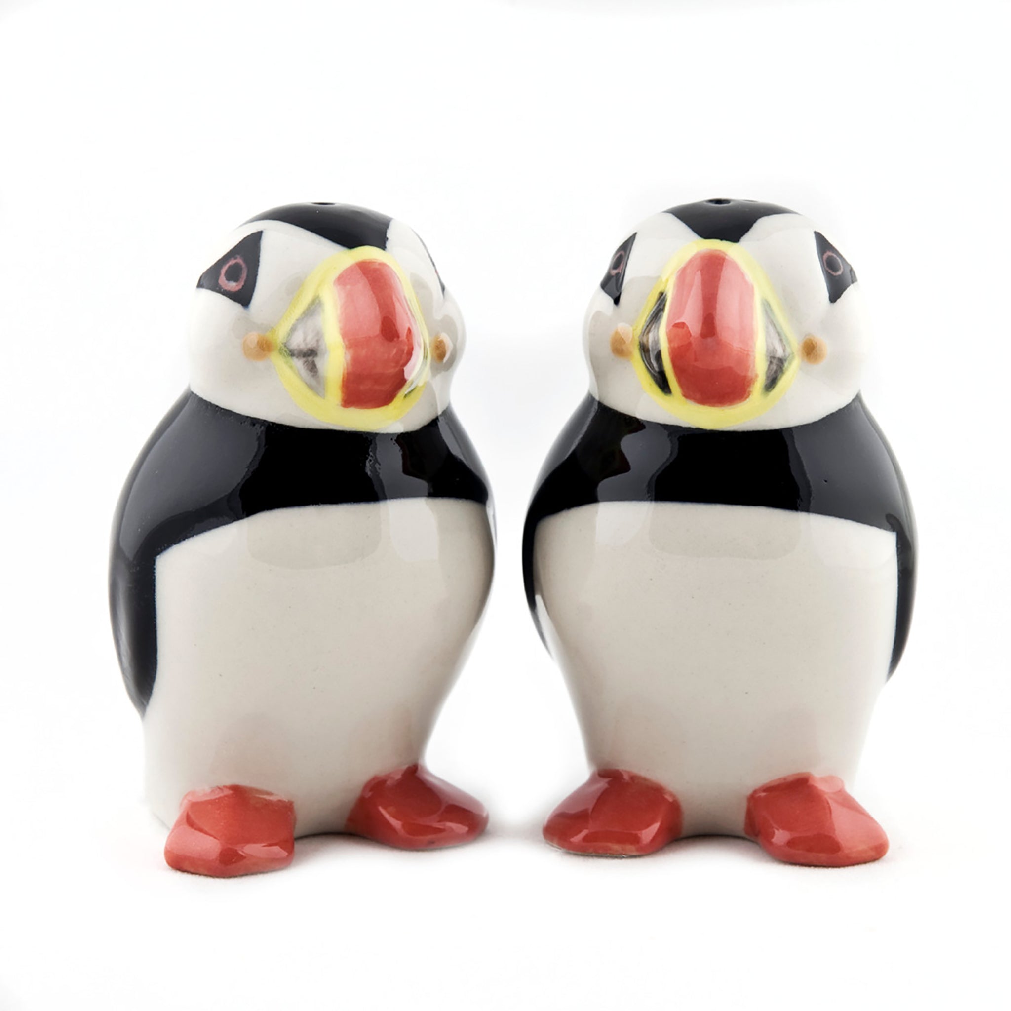 Pair of glazed salt and pepper shakers shaped like puffins front view