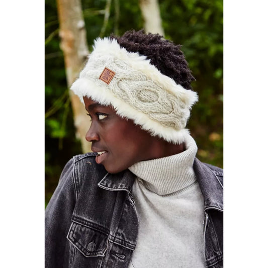 Model wearing a faux fur lined grey cable knit headband