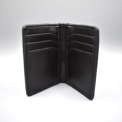 Inside of a charcoal faux leather card holder with 8 card slots