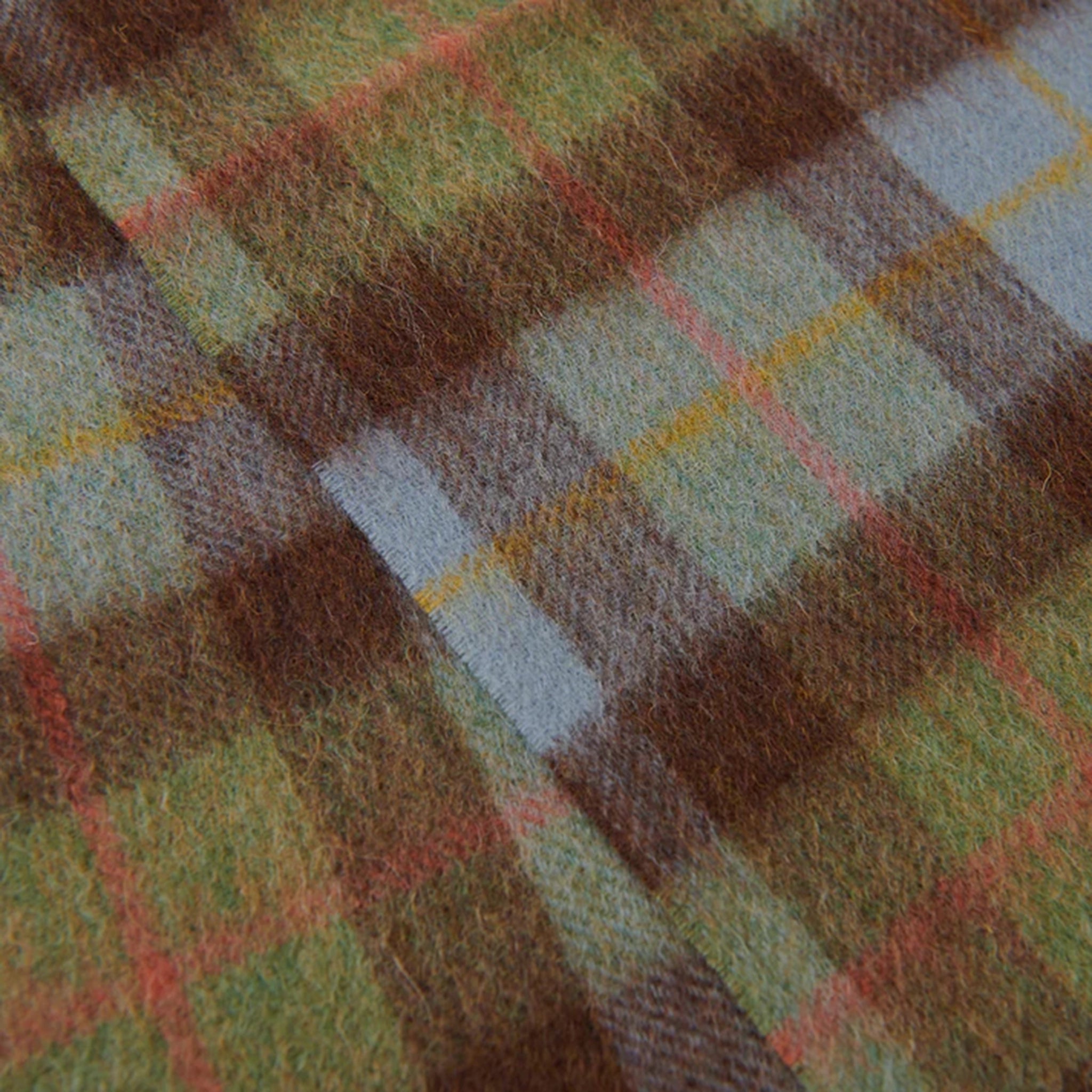 Close up of green, brown and blue wool tartan scarf