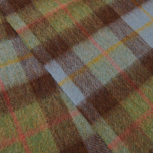 Close up of green, brown and blue wool tartan scarf