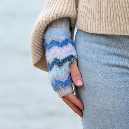 Model wearing fingerless grey gloves with brushed blue chevron stripe pattern