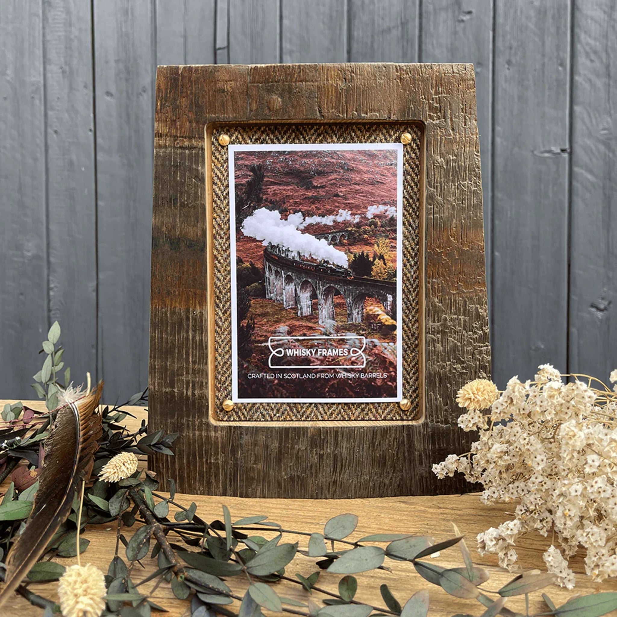 A frame made with whisky barrel wood and Harris Tweed lifestyle