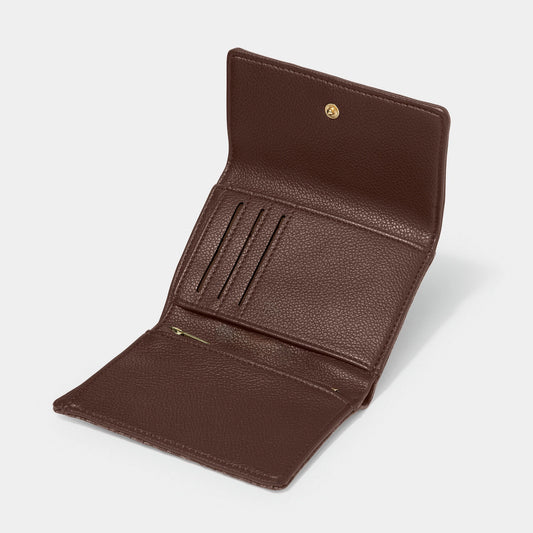 An open chocolate brown purse with 3 card slots, a zip pocket and a slip in pocket
