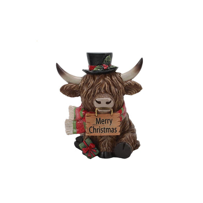 Christmas Highland cow figure with a wooden plaque that says 'Merry Christmas'