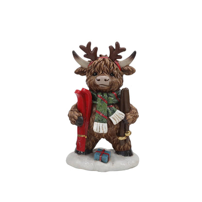 Highland cow Christmas figure with skis