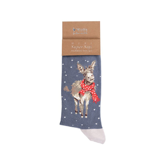 Folded pair of Christmas socks in blue with white heels and a donkey in a scarf in the snow