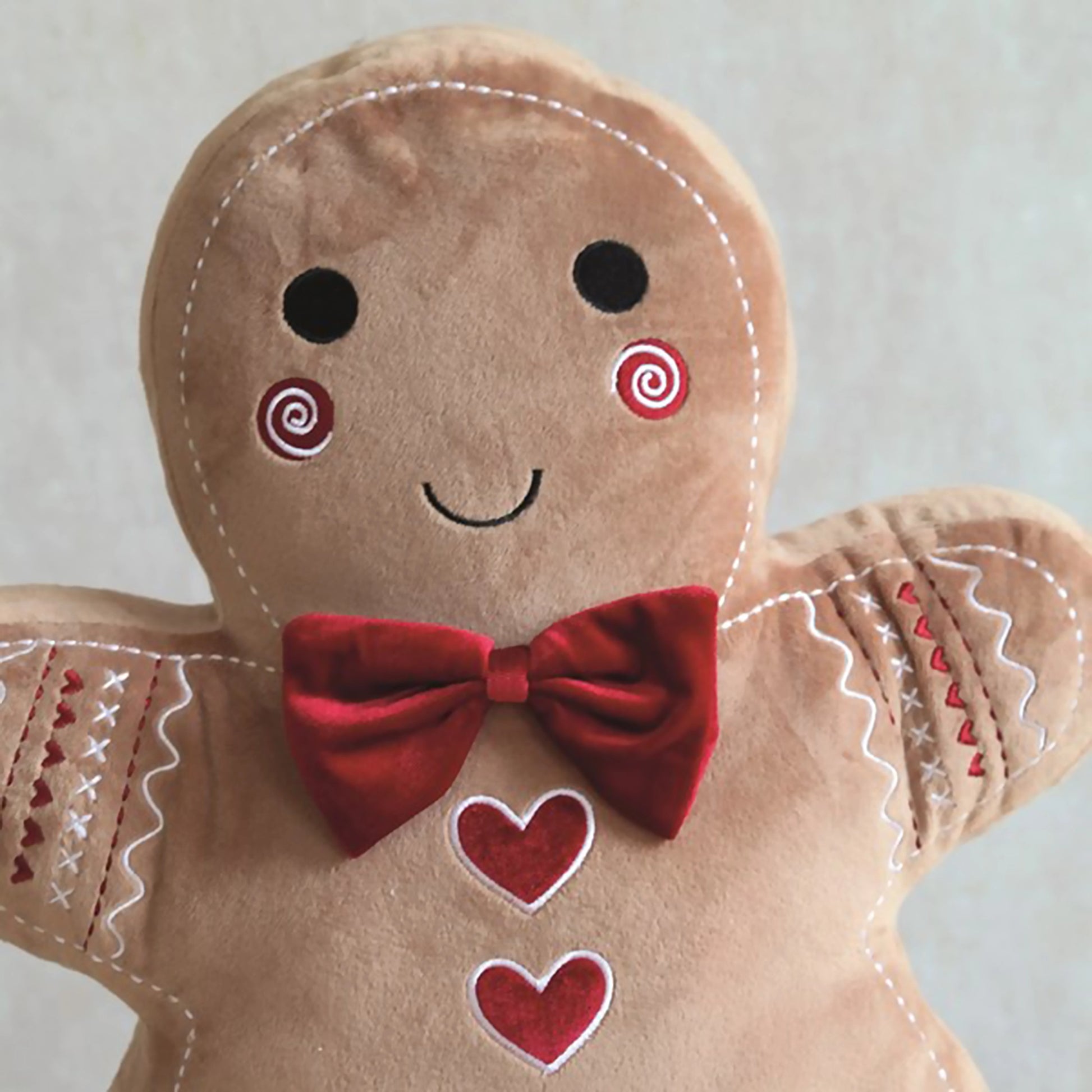 Gingerbread man cushion with embroidered details