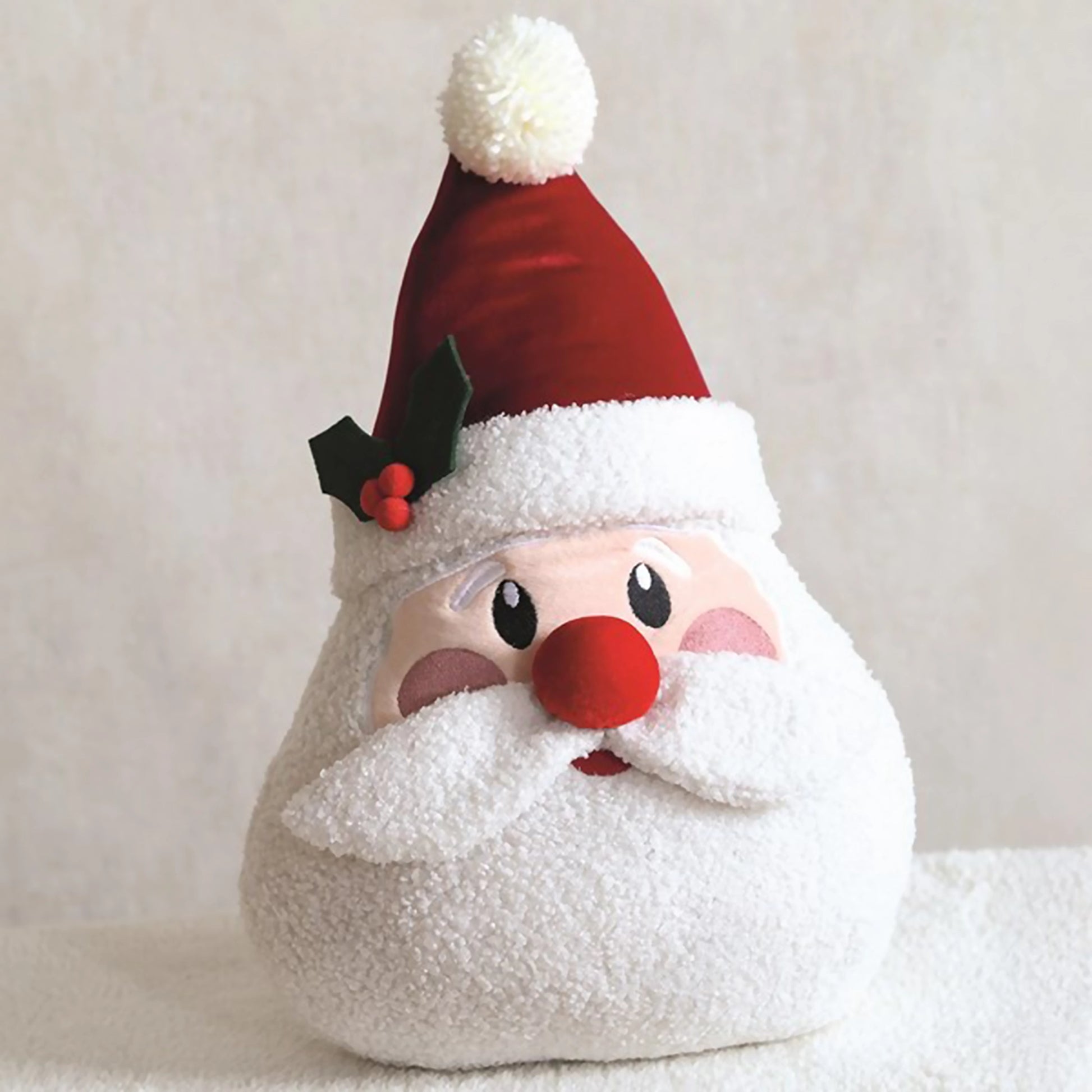 Santa head shaped cushion with rosy cheeks, hat and boucle beard